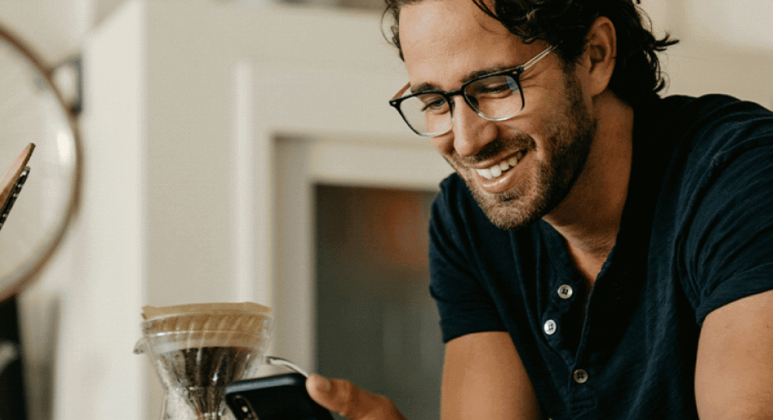 Man encouraging friends by sending Bible verses to them.