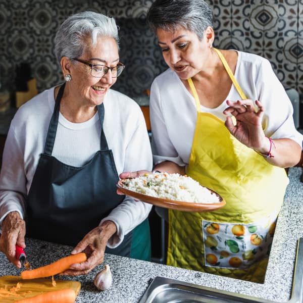 Two women cooking