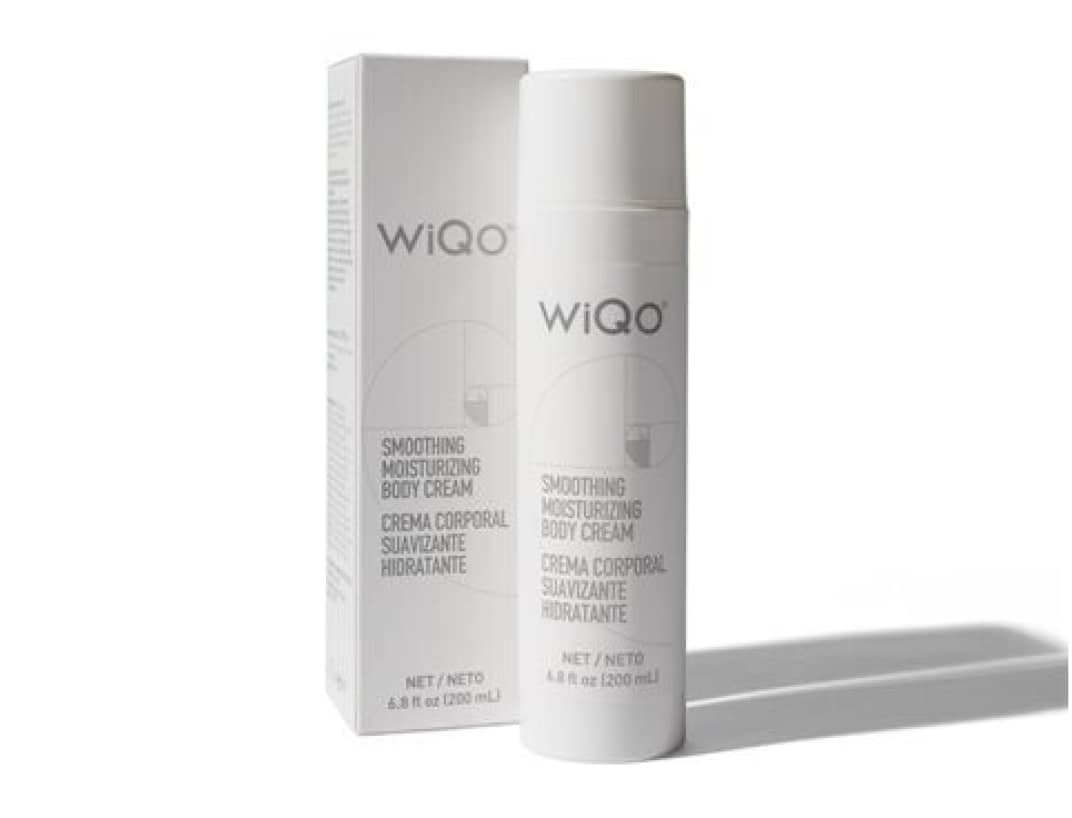WiQo Smoothing Moisturizing Body Cream bottle promoting a free gift offer for first 10 PRX clients.